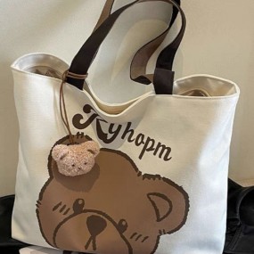 1枚 かわいいクマプリントキャンバストートバッグ 大容量 ベージュブラウンストラップ付き プラッシュベアチャーム付き 学校・仕事・カジュアルに最適 クマデコレーション